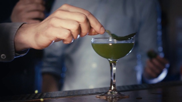 Video Reference: Tableware, Martini glass, Drinkware, Stemware, Cocktail, Drink, Fluid, Gesture, Alcoholic beverage, Classic cocktail