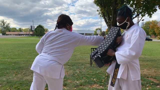 Video Reference: Sky, Cloud, Plant, Tree, People in nature, Gesture, Grass, Jacket, Happy, Belt