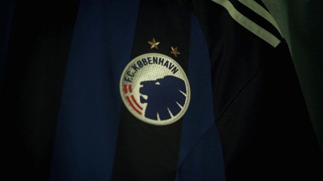 Video Reference: Sleeve, Flag of the united states, Flag, Emblem, Sportswear, Electric blue, Symbol, Event, Eagle, Uniform