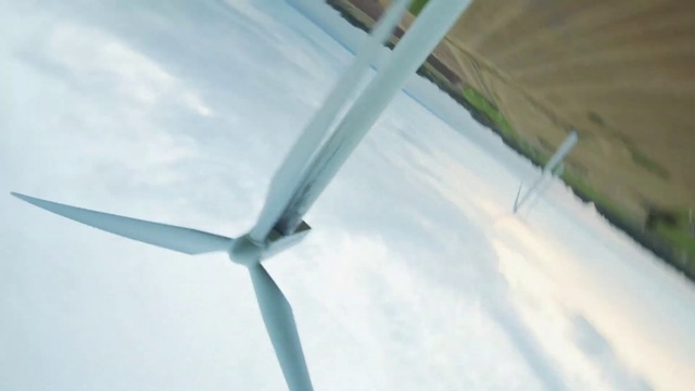 Video Reference: Windmill, Sky, Cloud, Wind farm, Slope, Composite material, Wind turbine, Electric blue, Wind, Machine
