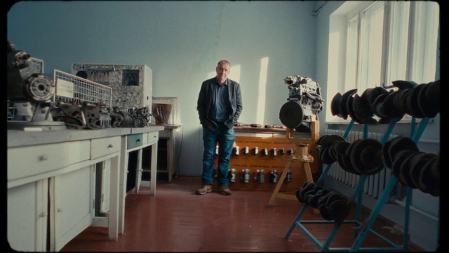 Video Reference: Cabinetry, Standing, Interior design, Flooring, Tripod, Building, Event, Art, Machine, Room