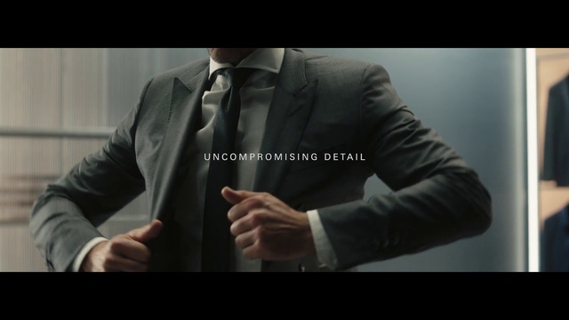 Video Reference: Hand, Dress shirt, Sleeve, Flash photography, Tie, Gesture, Collar, Suit, Font, Elbow