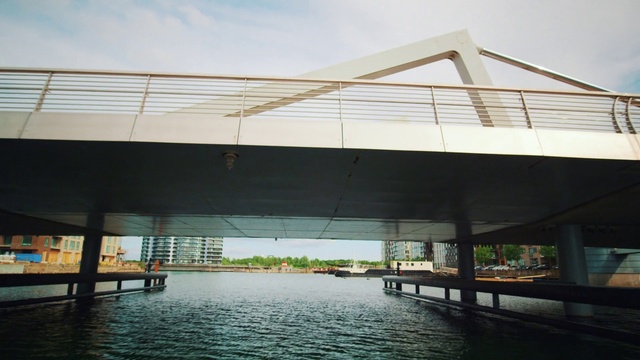 Video Reference: Water, Sky, Daytime, Building, Shade, Architecture, Lake, House, Bridge, Plant
