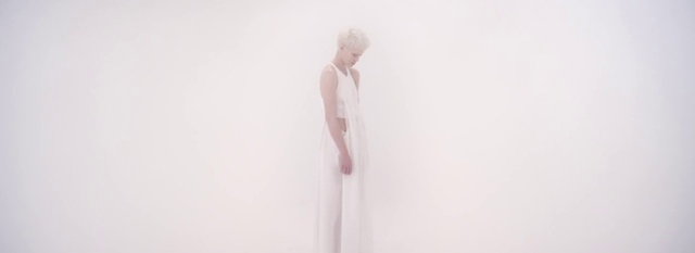 Video Reference: Outerwear, Arm, Shoulder, Human body, Neck, Sleeve, Gesture, Grey, Art, Elbow