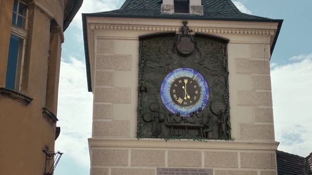 Video Reference: Sky, Daytime, Building, Cloud, Tower, Azure, Clock, Facade, Clock tower, Symmetry