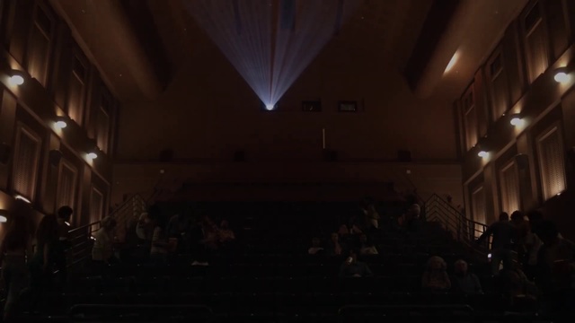 Video Reference: Musical instrument accessory, Chair, Entertainment, Hall, Building, Event, Darkness, Stage, Performing arts center, Curtain