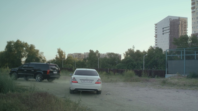 Video Reference: Tire, Sky, Car, Land vehicle, Automotive tail & brake light, Plant, Vehicle, Vehicle registration plate, Wheel, Building