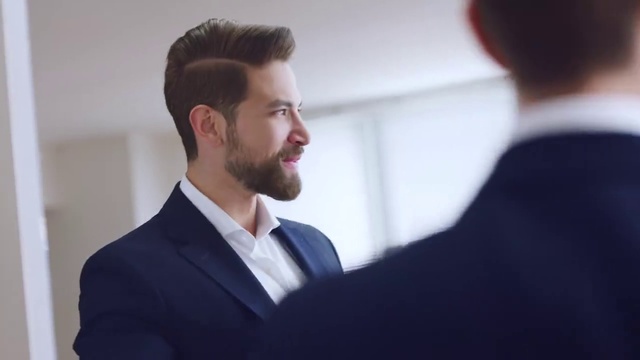 Video Reference: Forehead, Chin, Smile, Eyebrow, Beard, Dress shirt, Jaw, Flash photography, Sleeve, Gesture