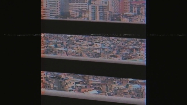 Video Reference: Rectangle, Glass, Tints and shades, Urban design, Art, Font, Electric blue, Shelving, Display device, Commercial building