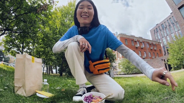 Video Reference: Footwear, Jeans, Shoe, Plant, Smile, Window, People in nature, Building, Leaf, Street fashion