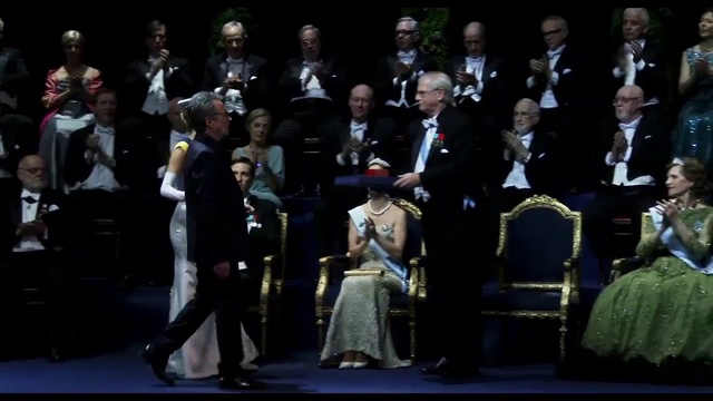 Video Reference: Coat, Chair, Suit, Entertainment, Military uniform, People, Music, Formal wear, Event, Musician