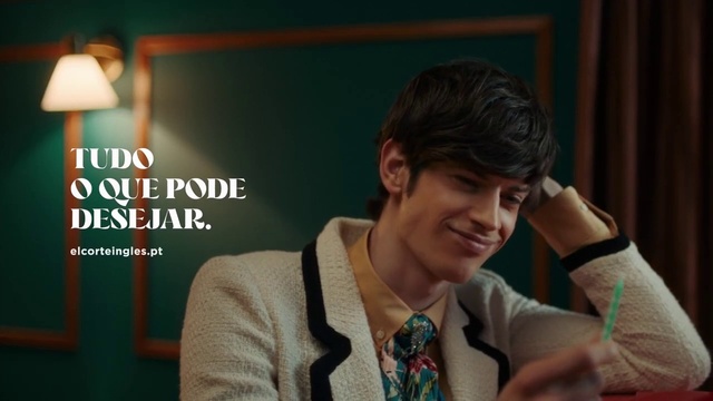 Video Reference: Forehead, Chin, Facial expression, Gesture, Dress shirt, Smile, Adaptation, Blazer, Flash photography, Audio equipment