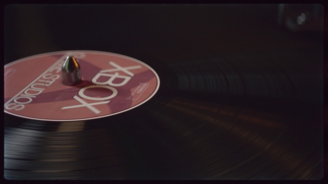 Video Reference: Gramophone record, Wood, Record player, Font, Poker table, Magenta, Circle, Event, Indoor games and sports, Carmine