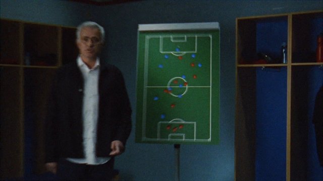 Video Reference: soccer, football, tactics board, coach, presentation, indoor, man, strategy, sports, team, blurred, training, analysis