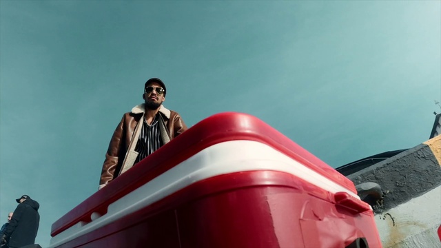 Video Reference: Sky, Smile, Travel, Hat, Jacket, Street fashion, Eyewear, Automotive design, Sunglasses, Fashion design