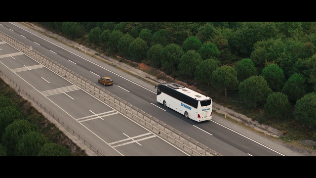 Video Reference: Tire, Vehicle, Bus, Motor vehicle, Wheel, Road surface, Car, Asphalt, Automotive lighting, Automotive design