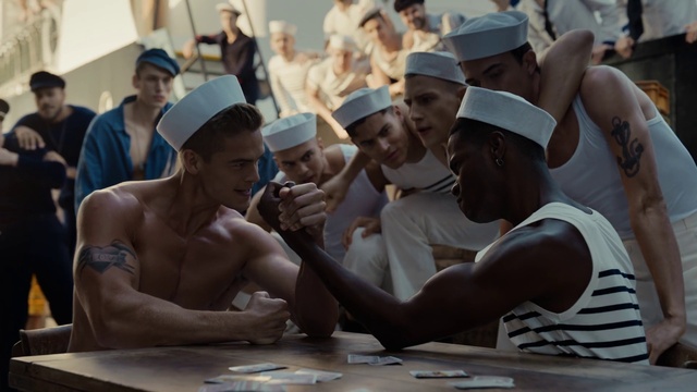 Video Reference: Muscle, Cap, Hat, Gesture, Baseball cap, Headgear, Sun hat, Table, Community, Smile