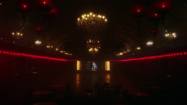 Video Reference: Entertainment, Chair, Building, Electricity, Ceiling, Event, Performing arts, Darkness, Symmetry, Stage