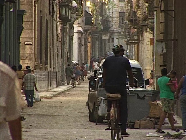 Video Reference: Wheel, Trousers, Tire, Bicycle, Infrastructure, Vehicle, Bicycle wheel, Building, Temple, Lighting