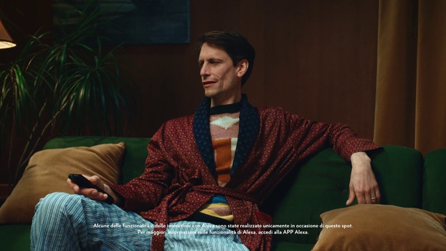 Video Reference: Couch, Plant, Houseplant, Fashion design, Beard, Chair, Formal wear, Event, Entertainment, Facial hair