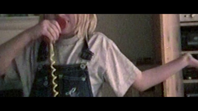 Video Reference: Mouth, Jaw, Sleeve, Gesture, Beard, Eyewear, Thumb, Font, Street fashion, Music