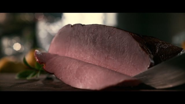Video Reference: raw meat, meat slice, knife, cutting board, close-up, food preparation, cooking, butcher, fresh meat, macro, restaurant, chef, kitchen