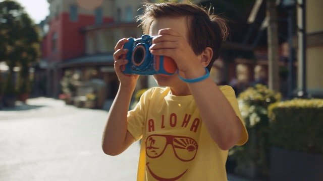 Video Reference: Photographer, Street fashion, Camera, Happy, Gesture, Yellow, Eyewear, Travel, Digital camera, Cameras & optics