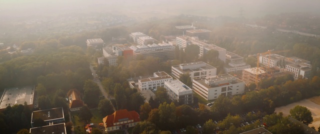 Video Reference: Building, Atmosphere, Urban design, Tower block, Atmospheric phenomenon, Tree, Plant, Residential area, Landscape, Fog