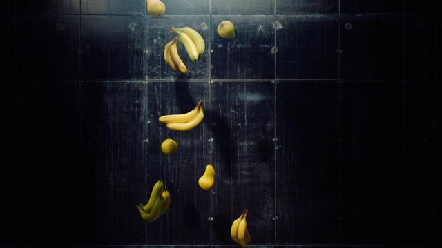 Video Reference: bananas, fruit, floating, dark background, still life, abstract, yellow, tiled wall, vertical composition, food, surreal, minimal, motion, studio