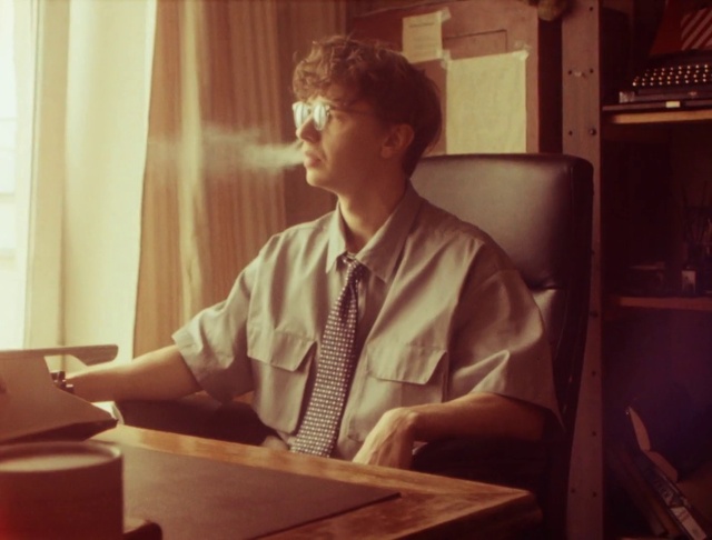 Video Reference: Standing, Wood, Window, Table, Tints and shades, Tie, Eyewear, Curtain, Office equipment, White-collar worker