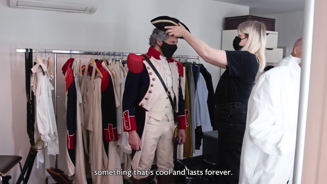 Video Reference: Sleeve, Tie, Hat, Fashion design, Blazer, Formal wear, Uniform, Event, Glove, Room