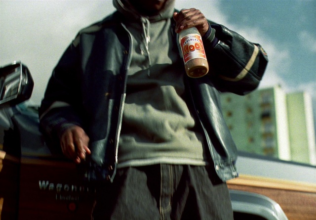 Video Reference: Outerwear, Sleeve, Bottle, Leather jacket, Audio equipment, Personal protective equipment, Beer, Sportswear, Eyewear, Belt