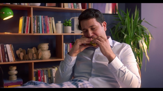 Video Reference: Shelf, Bookcase, Plant, Book, Gesture, Publication, Dress shirt, Shelving, Facial hair, Tableware