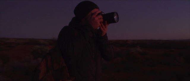 Video Reference: Flash photography, Landscape, Jacket, Midnight, Facial hair, Event, Sky, Entertainment, Darkness, Baseball cap