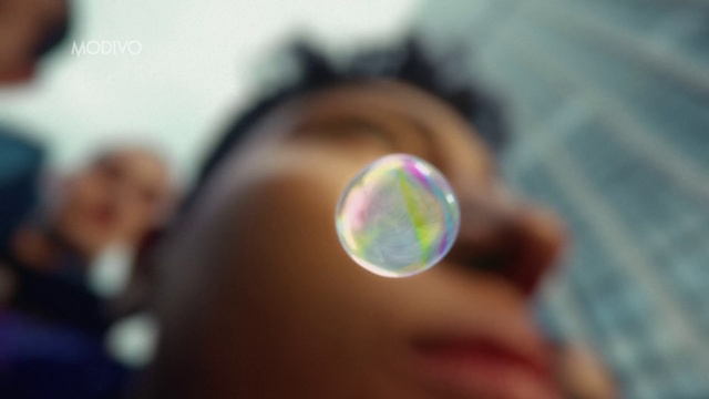 Video Reference: Hand, Finger, Cameras & optics, Happy, Lens flare, Circle, Astronomical object, Electric blue, Liquid bubble, Event