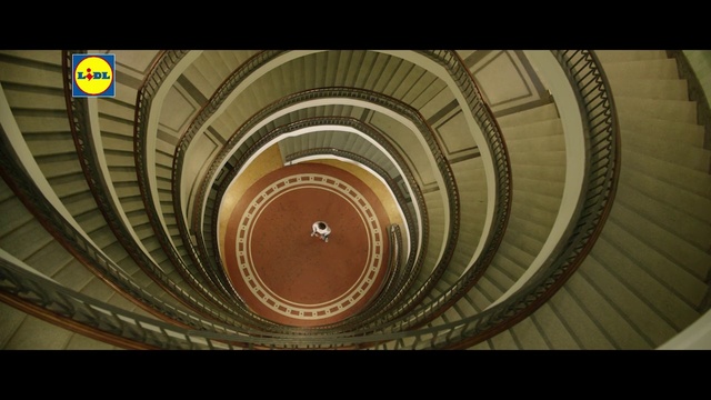 Video Reference: Brown, Stairs, Wood, Automotive tire, Tints and shades, Circle, Symmetry, Pattern, Ceiling, Spiral