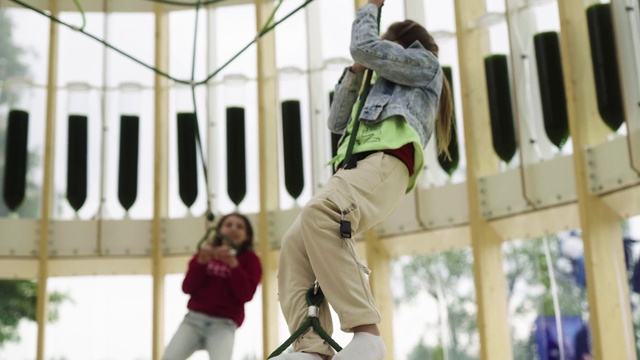 Video Reference: Photograph, White, Leisure, Fun, Sneakers, Outdoor shoe, Recreation, Outdoor play equipment, Rope, Helmet