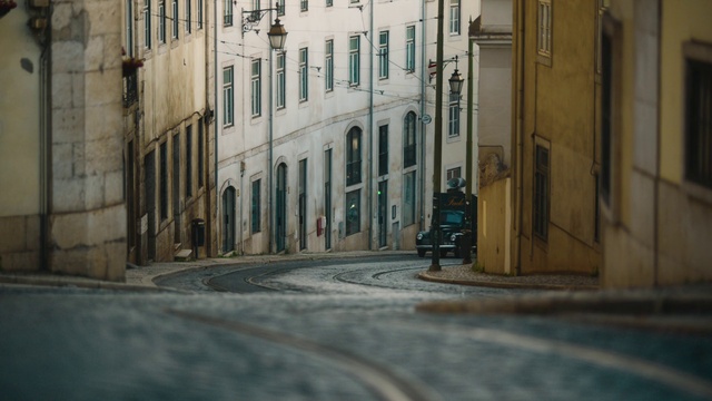 Video Reference: Building, Tire, Window, Blue, Road surface, Wood, Door, Wheel, Mode of transport, Asphalt