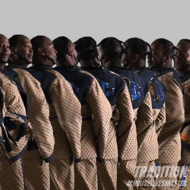 Video Reference: Gesture, Headgear, Crew, Automotive tire, Personal protective equipment, Fashion design, Event, Uniform, Team, Pattern