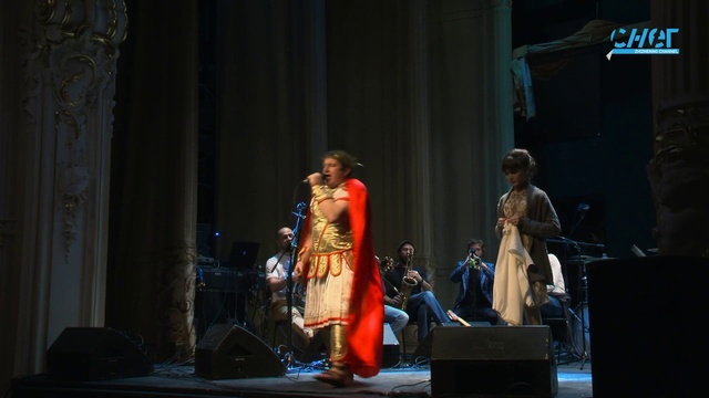 Video Reference: Dress, Musical instrument, Entertainment, Performing arts, Curtain, Musical instrument accessory, Microphone, Artist, Music, Chair