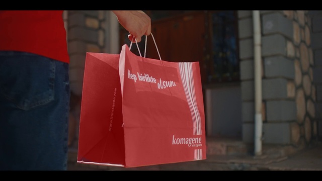 Video Reference: Paper bag, Luggage and bags, Bag, Font, Packaging and labeling, Magenta, Event, Carmine, Fashion accessory, Rectangle