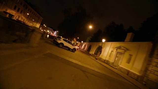 Video Reference: Street light, Automotive lighting, Sky, Window, Road surface, Tire, Plant, Building, Asphalt, Car