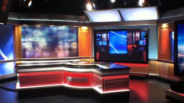 Video Reference: news studio, television set, anchor desk, broadcast, studio lights, screens, newsroom, empty set, modern interior, red black, media, studio background
