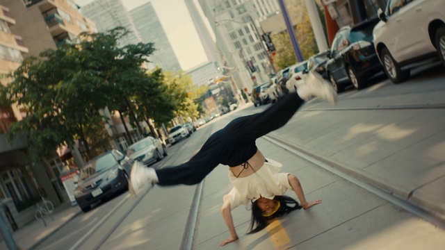 Video Reference: Car, Tire, Wheel, Hand, Vehicle, Building, Window, Plant, Street fashion, Tree