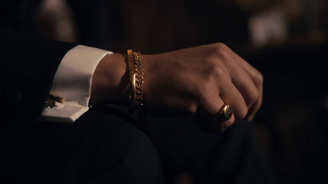 Video Reference: Hand, Arm, Body jewelry, Human body, Dress, Neck, Sleeve, Gesture, Finger, Wrist