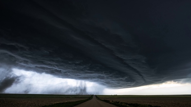 Video Reference: Cloud, Plant, Atmosphere, Sky, Natural environment, Natural landscape, Road surface, Asphalt, Highland, Grass