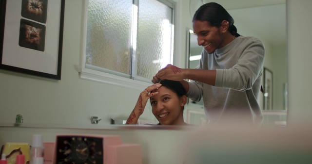 Video Reference: Smile, Eyebrow, Mirror, Eyelash, Tap, Plumbing fixture, Gesture, Happy, Picture frame, Beauty salon