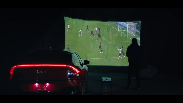 Video Reference: Automotive tail & brake light, Soccer, Automotive lighting, Automotive design, Display device, Player, Darkness, Personal luxury car, Event, Vehicle door