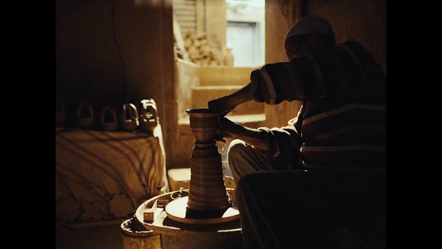 Video Reference: pottery, ceramics, artisan, craft, handmade, workshop, traditional, indoor, silhouette, wheel, clay, manual, warm light, local craft