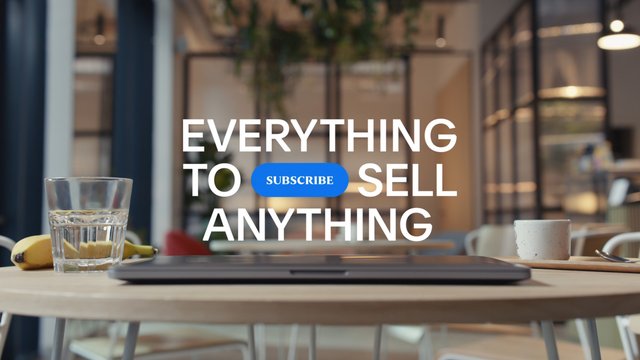 Video Reference: office, cafe, laptop, table, glass, banana, mug, interior, blurred background, text overlay, subscribe, promotion, workspace, desk, modern, commercial